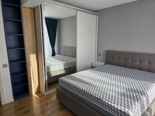 Ένα ή περισσότερα κρεβάτια σε δωμάτιο στο Apartament Blue Shark