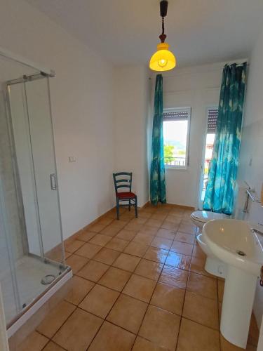 a bathroom with a shower and a toilet and a sink at Horizon Apt in Taormina