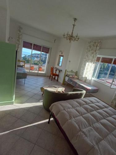 a living room with a bed and a couch at Horizon Apt in Taormina