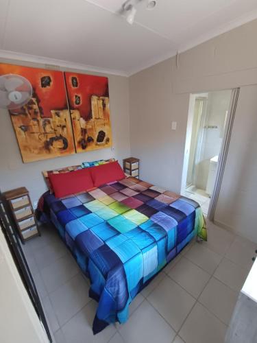 En eller flere senge i et værelse på Sunrise Holidays