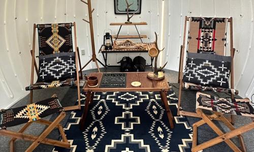 a room with two chairs and a table at Kuruma Asobi Adventure Field Appi - Camp - Vacation STAY 42095v in Hachimantai