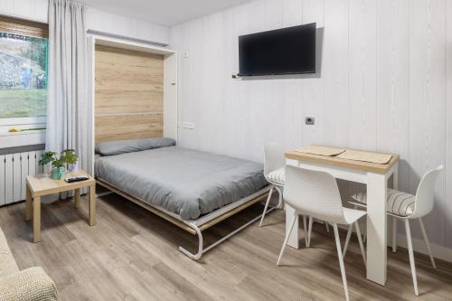 Ένα ή περισσότερα κρεβάτια σε δωμάτιο στο Loft Relajante Est esquí La Pinilla