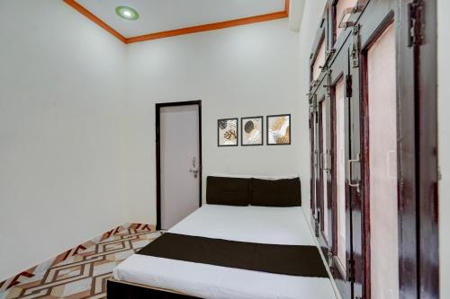 Postel nebo postele na pokoji v ubytování Hotel O Kv Building