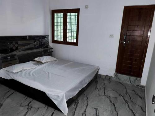 Ένα ή περισσότερα κρεβάτια σε δωμάτιο στο Hotel O Easy stay