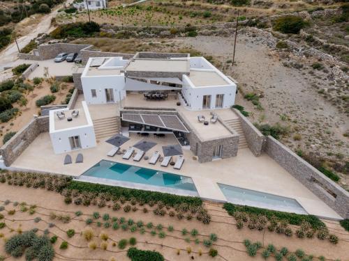 an aerial view of a house with a swimming pool at Aegean Hestia Luxury Villa of Paros in Kampos Paros