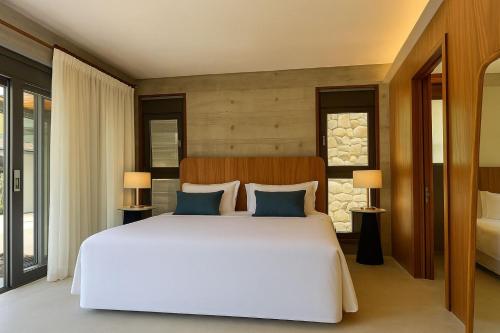 Ένα ή περισσότερα κρεβάτια σε δωμάτιο στο Juquehy Praia Hotel