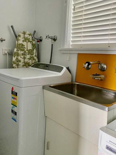 a small kitchen with a sink next to a sink at 99 Hill Street Apartments in Orange