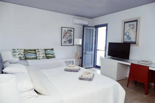 Postel nebo postele na pokoji v ubytování Villas Velanidies