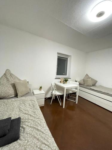 En eller flere senge i et værelse på Gemütliches DG-Apartment in Weißenthurm, Wohnung 4