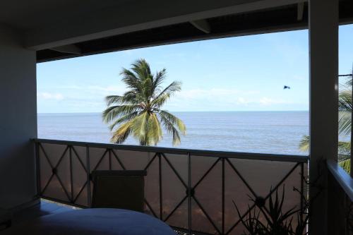 a view of the ocean from the balcony of a condo at Kaz Mboa Vista - Rémire-Montjoly in Montjoly