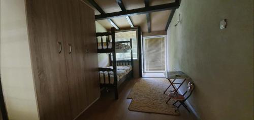 a hallway with a room with a bed and a window at Svinista vilage in Kičevo