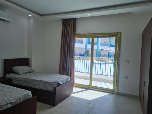 Postel nebo postele na pokoji v ubytování Mirage Bay Resort & Aqua Park