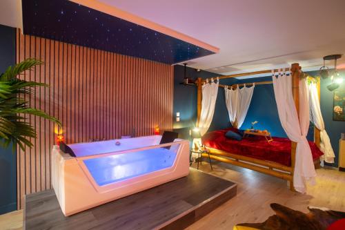 a large bathroom with a tub in a room at Twilight Star Spa - Sauna & Private Cinema - Free Parking in Amiens