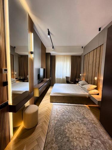 Ένα ή περισσότερα κρεβάτια σε δωμάτιο στο Lambo Apartments