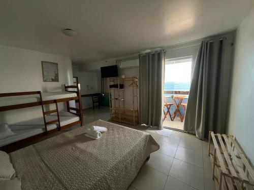 Ένα ή περισσότερα κρεβάτια σε δωμάτιο στο Pousada Mar Aberto