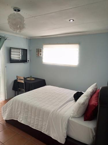 Ένα ή περισσότερα κρεβάτια σε δωμάτιο στο The Tranquility Suite & Spa