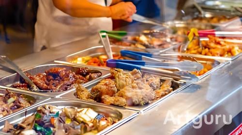 a buffet line with many different types of food at kodus hotel boutique in Pattaya South