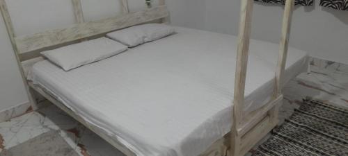 Un ou plusieurs lits dans un hébergement de l'établissement Zlaal Lounge