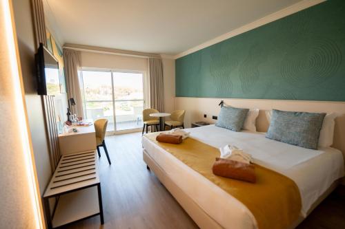 Postel nebo postele na pokoji v ubytování Ukino Palmeiras Village - 24h All Inclusive