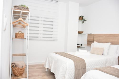 Ένα ή περισσότερα κρεβάτια σε δωμάτιο στο Vivienda Turística La Cordobesa