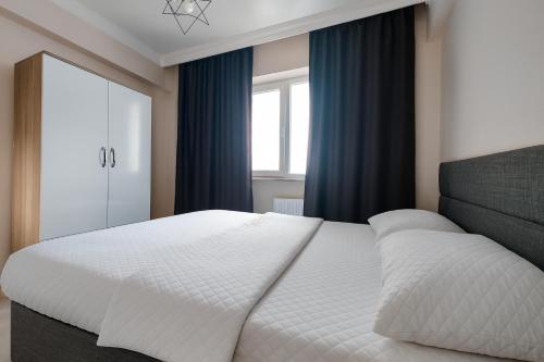 Ένα ή περισσότερα κρεβάτια σε δωμάτιο στο PARADİSE pansiyon otel