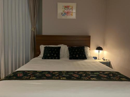 Un pat sau paturi într-o cameră la 광안리해수욕장 30초 베이비 맞춤 풀옵션 패밀리 안심 숙소