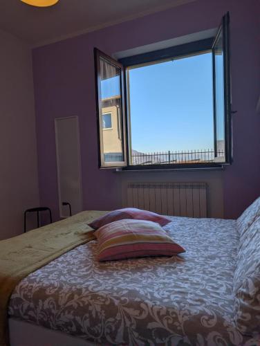 Ένα ή περισσότερα κρεβάτια σε δωμάτιο στο Appartamento Albachiara