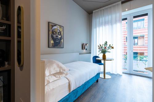 En eller flere senge i et værelse på AH - Collezione Brera