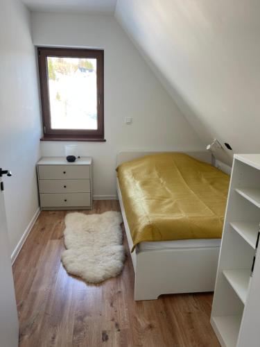 En eller flere senge i et værelse på Domek Rodzinny Martynka