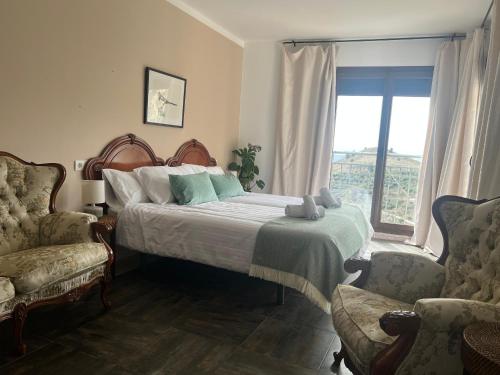 Postel nebo postele na pokoji v ubytování Casería 7 Fuentes - Casa Hotel