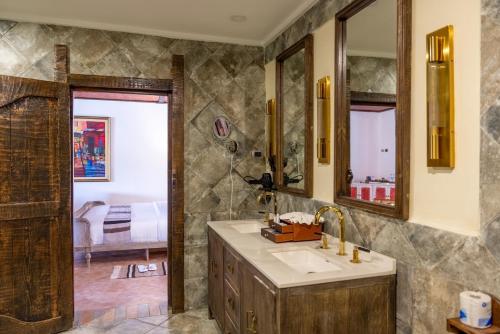 a bathroom with a sink and a mirror at Kuriftu Resort & Spa Bishoftu in Debre Zeyit