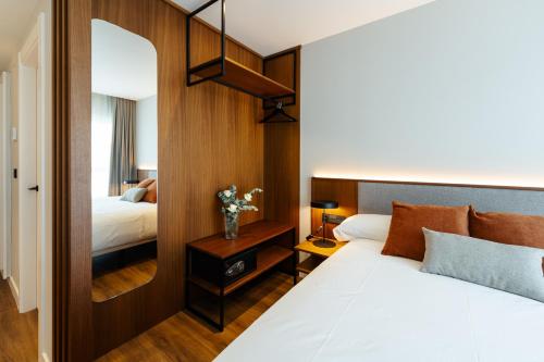 Postel nebo postele na pokoji v ubytování Apartamentos 2H LIVING