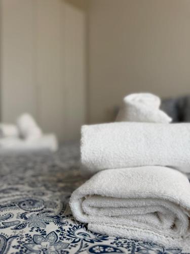 En eller flere senge i et værelse på Re Home Riccione