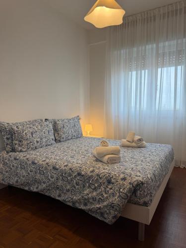 En eller flere senge i et værelse på Re Home Riccione