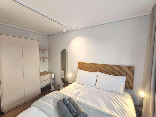 Postel nebo postele na pokoji v ubytování Wavescapes Shoreline Stay