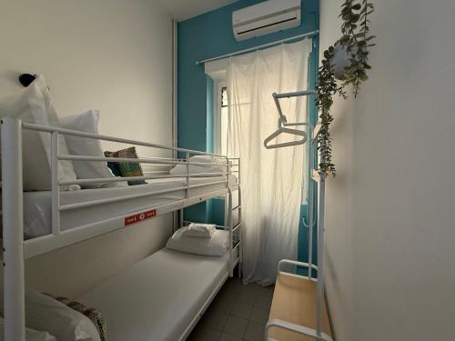 Ένα ή περισσότερα κρεβάτια σε δωμάτιο στο QUO Milano