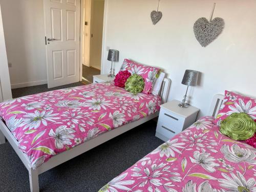 Ένα ή περισσότερα κρεβάτια σε δωμάτιο στο Tranquil Sands Holiday Home