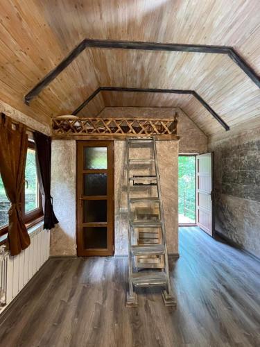a ladder in the middle of a room with a ceiling at Dili Heaven in Dilijan