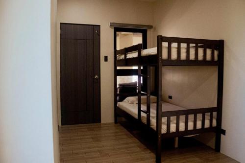 Giường trong phòng chung tại Meiyi Hot Spring Resort