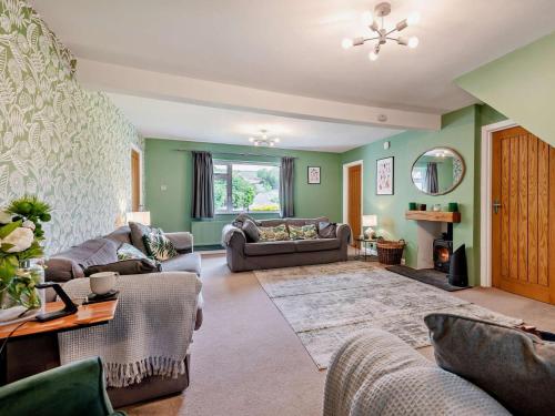 a living room with a couch and a table at 5 Bed in Wareham oc-83036 in West Lulworth