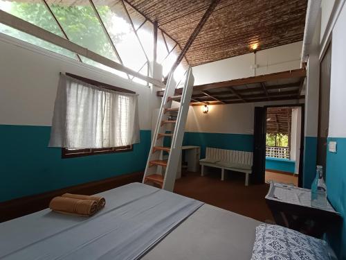 Ένα ή περισσότερα κρεβάτια σε δωμάτιο στο Varkala Calaila Boutique Stay