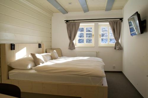 Un pat sau paturi într-o cameră la Prezidentská