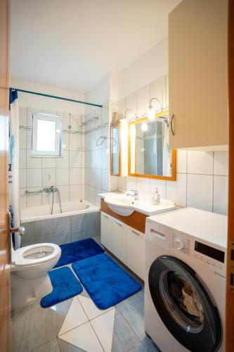 a bathroom with a washer and a washing machine at DREAM Home Ioannina in Ioannina