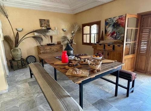 a dining room with a table with food on it at Darsawani in Triffa