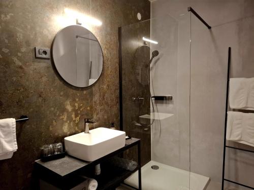 Koupelna v ubytování Artearia Hotel