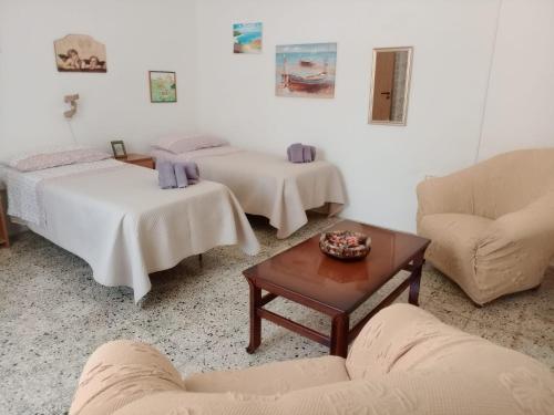 Un pat sau paturi într-o cameră la Villa Angelica