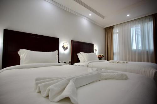 Llit o llits en una habitació de Tafach Hotel