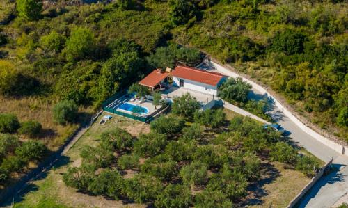 an aerial view of a house with a swimming pool at Holiday House Olive in Solin