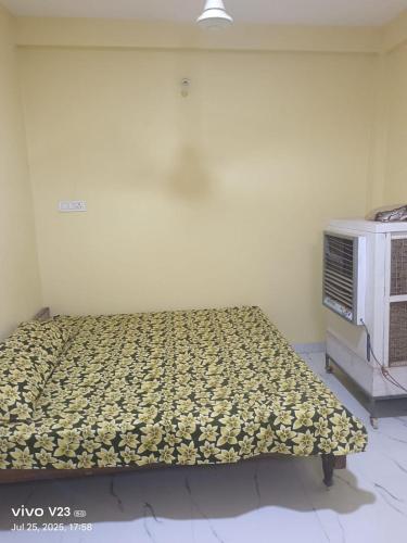 Postel nebo postele na pokoji v ubytování Rudra Guest House