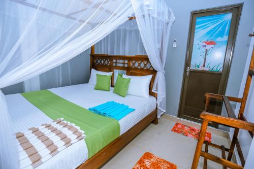 a bedroom with a bed and a window at Sanda Hiru Guest in Mirissa